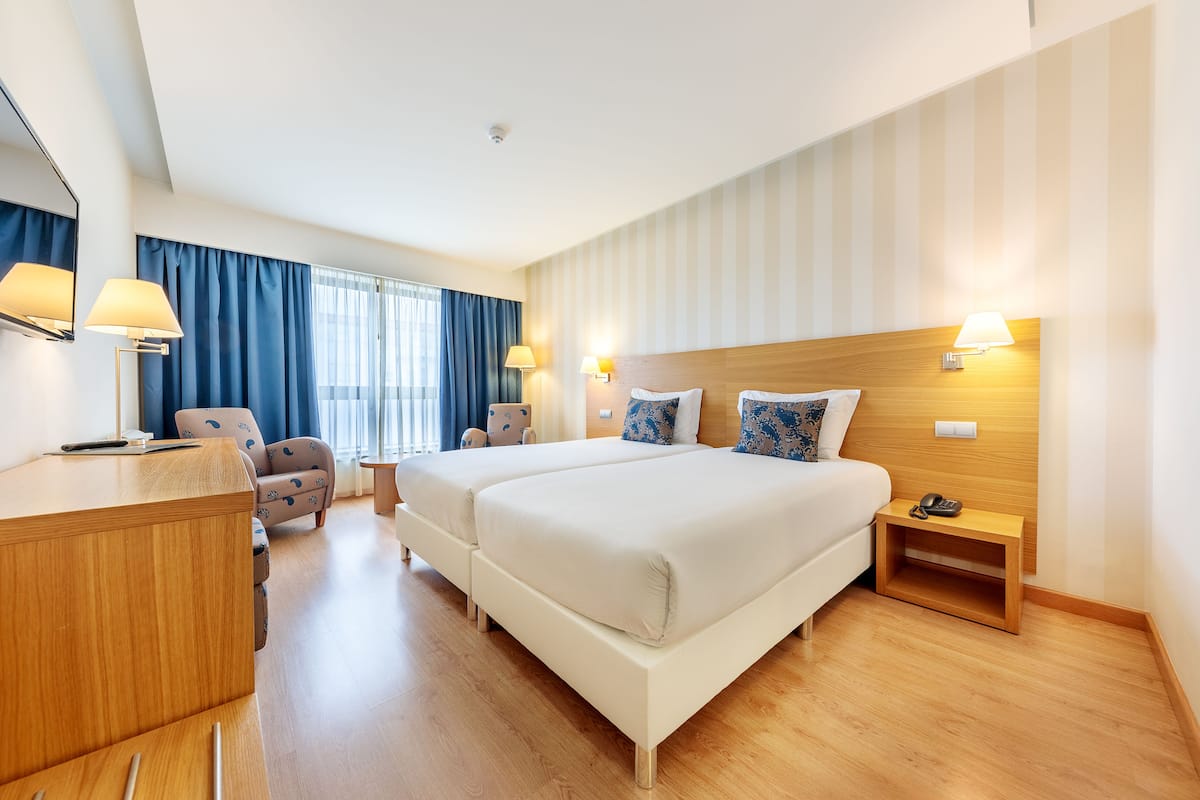 minibar, desk, laptop workspace, blackout curtains