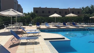 Outdoor pool, pool umbrellas, pool loungers