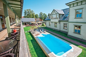 Seasonal outdoor pool, pool loungers