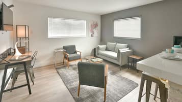 Chic Designer One Bedroom and One Queen Bed Full Kitchen | Living area | 42-inch flat-screen TV with cable channels, TV, iPod dock