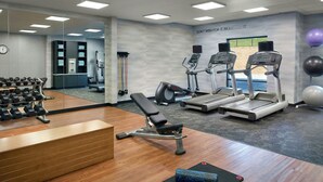 A gym with treadmills, elliptical machines, a bench, and free weights. - Fairfield Inn & Suites by Marriott Asheville Airport/Fletcher (Fletcher)