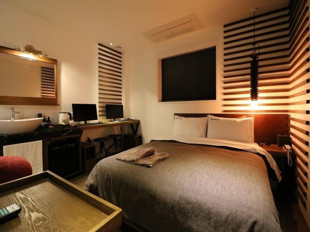 Luxe beddengoed, een kluis op de kamer, een strijkplank/strijkijzer