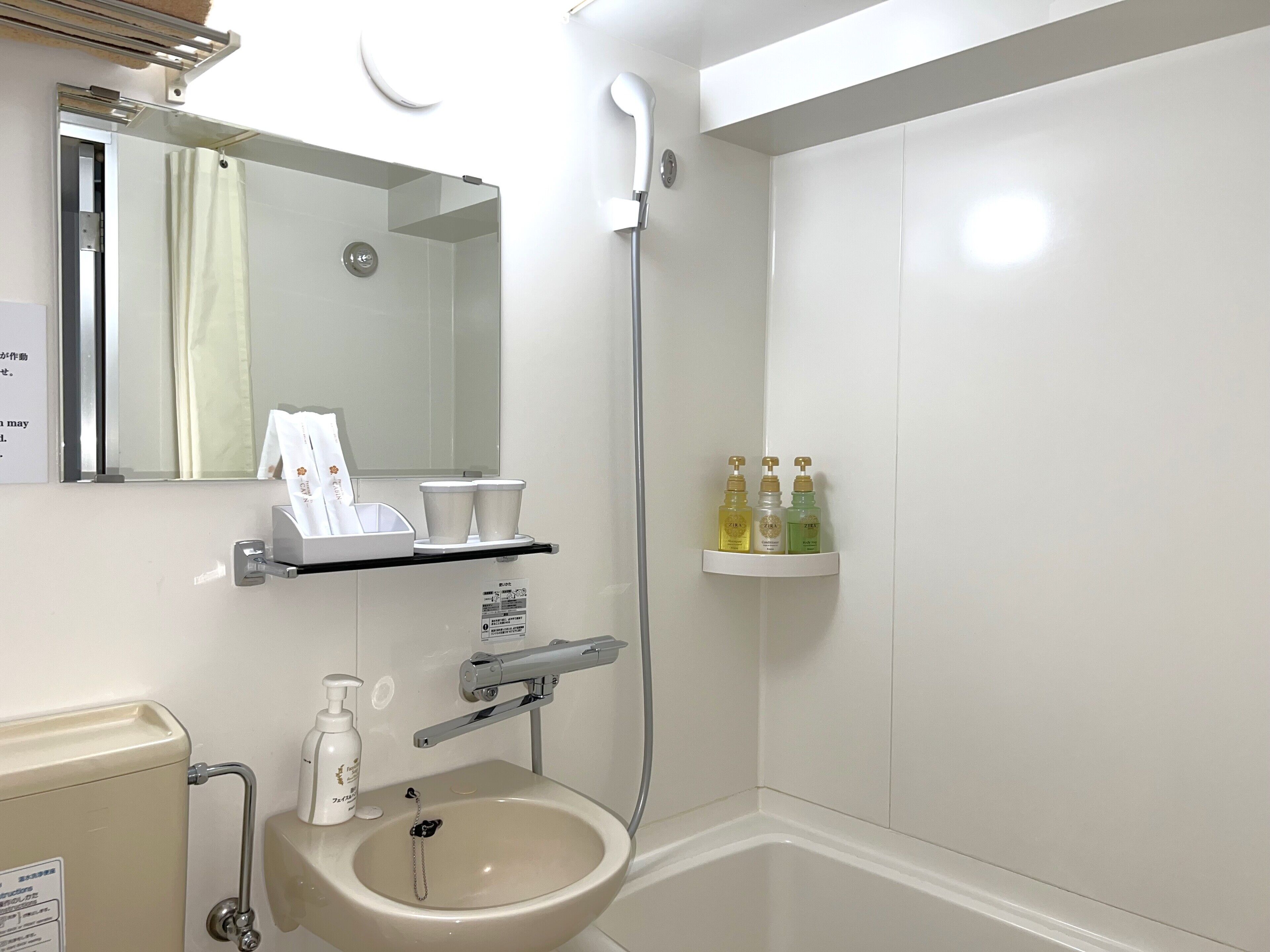 combined shower/bathtub, hair dryer, slippers, electronic bidet