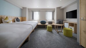 A hotel room with a large bed, a desk, a television, and a window with curtains. - Premier Hotel Cabin Sapporo (Sapporo)