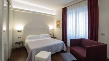 Deluxe Double Room, Partial Sea View | Minibar, in-room safe, desk, soundproofing