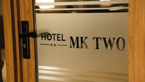 A door with the text "HOTEL MK TWO" and a lock.