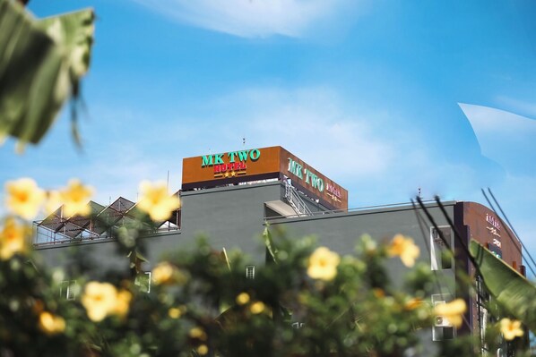 A hotel sign with the name "MK TWO HOTEL" against a clear blue sky. - Minh Kieu 2 Hotel (My Tho)