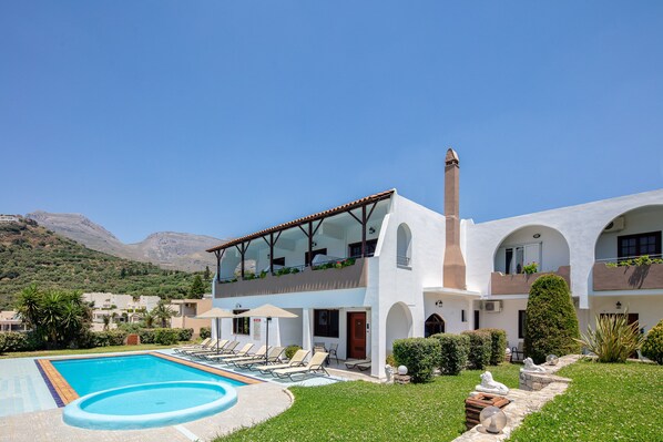 Experience the serene atmosphere of this two-story property, surrounded by well-maintained gardens and a stunning mountain view.