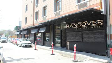 A building with a sign reading "HANGOVER CENTRAL HOTEL".