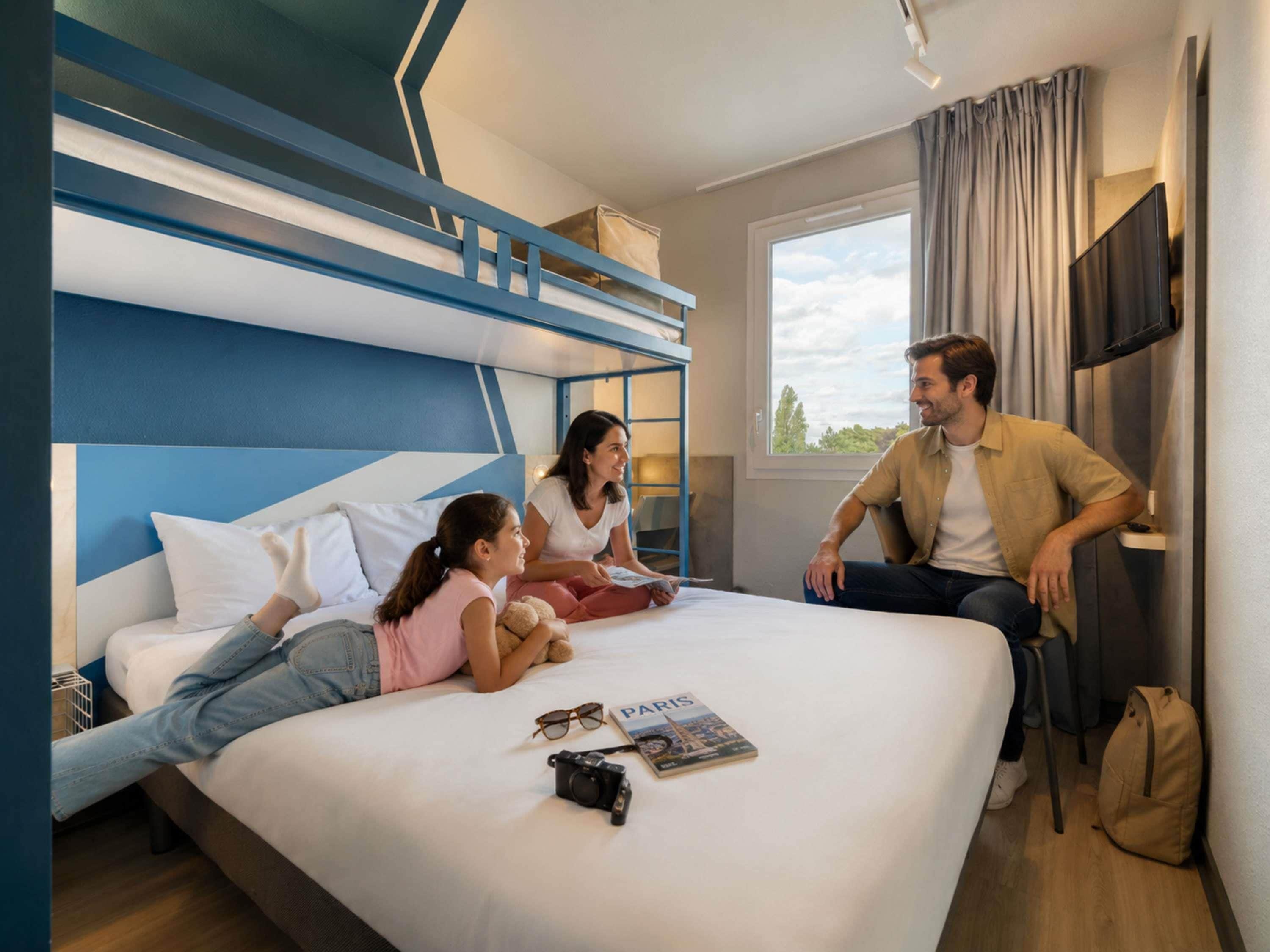 Premium bedding, desk, laptop workspace, blackout drapes