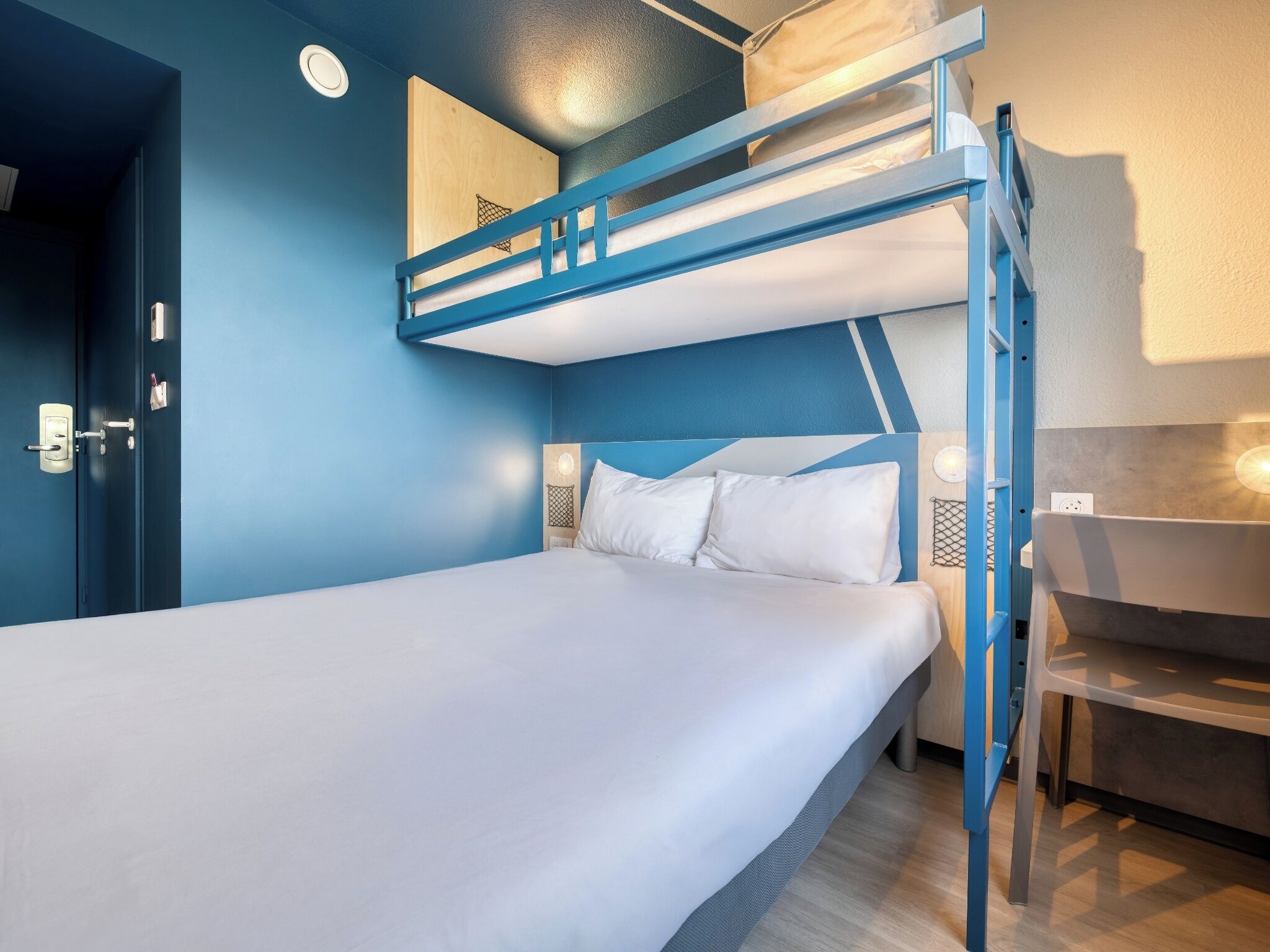 Premium bedding, desk, laptop workspace, blackout curtains