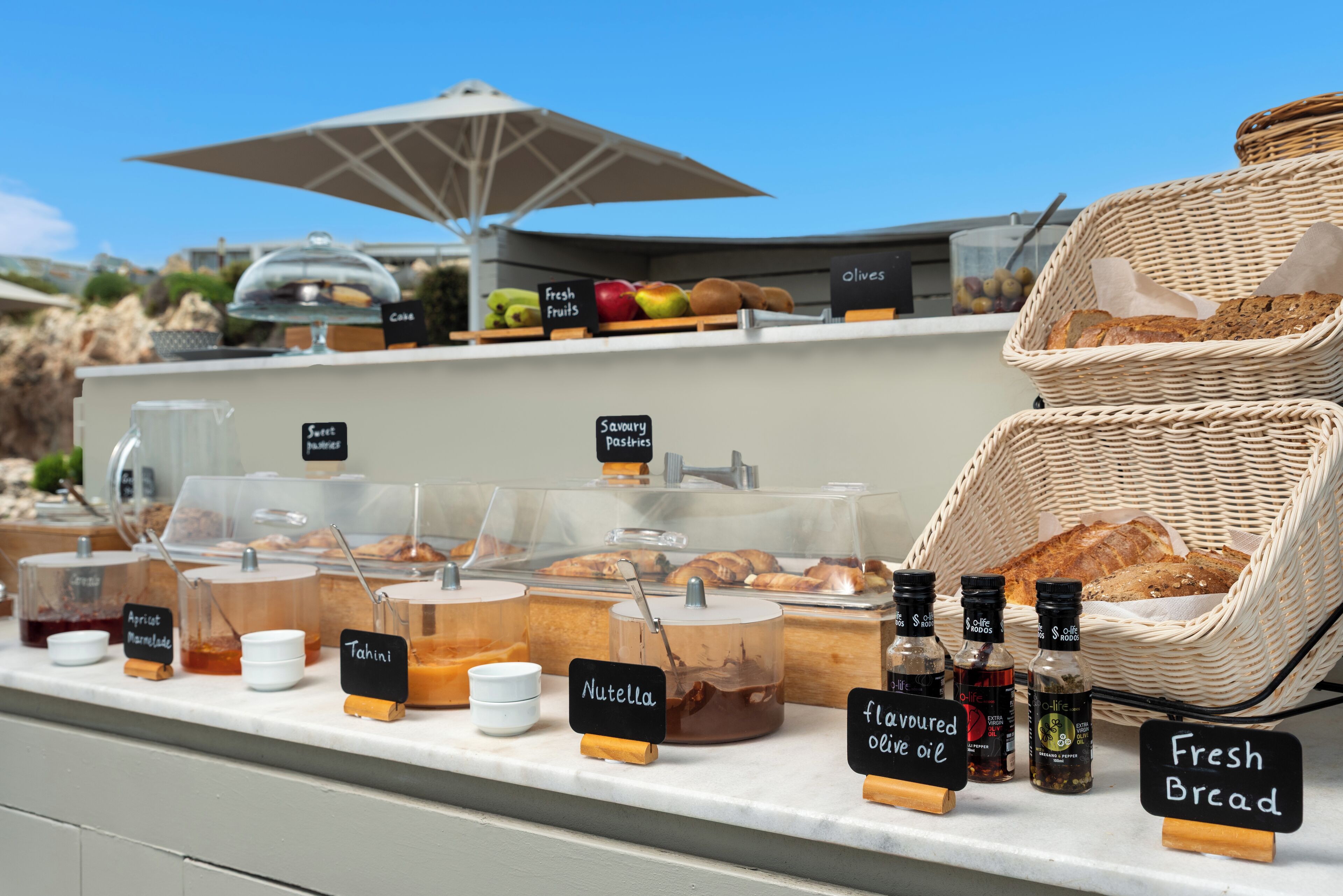 A breakfast buffet with various food items and condiments.