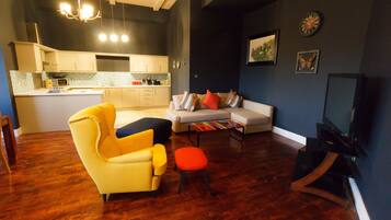 City Apartment, 3 Bedrooms, City View | Living area | Flat-screen TV