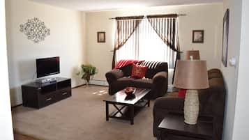 Premium Apartment, Mountain View | Living room | 39-inch flat-screen TV with cable channels, TV, DVD player