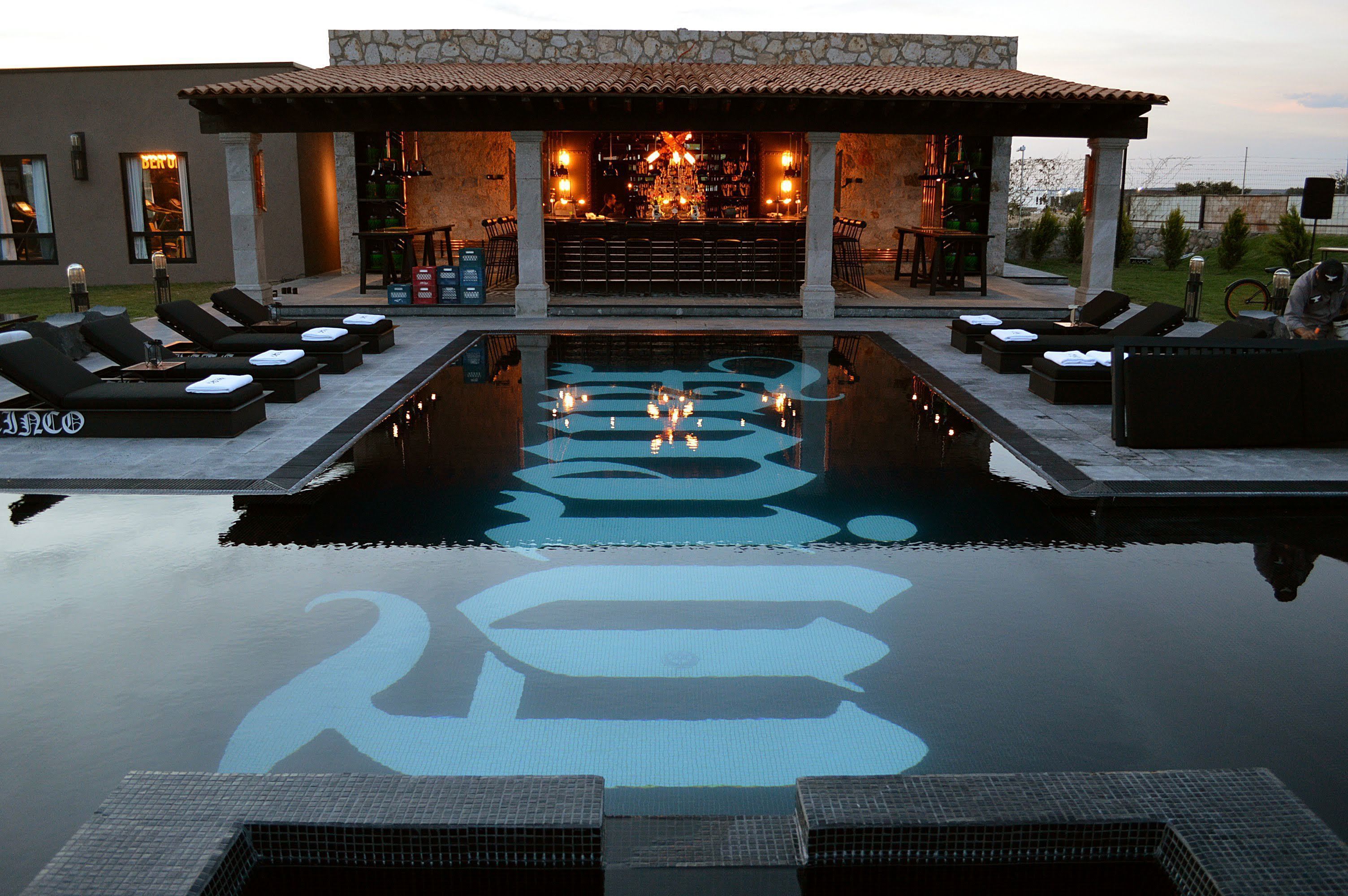 outdoor pool, open 10:00 am to 9:00 pm, pool umbrellas, pool loungers