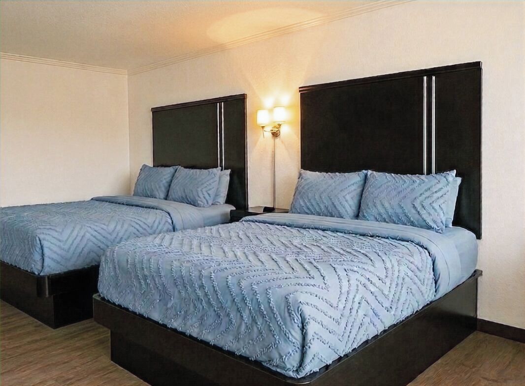 Standard Room, 2 Queen Beds, Non Smoking | Desk, iron/ironing board, WiFi (free), bed sheets