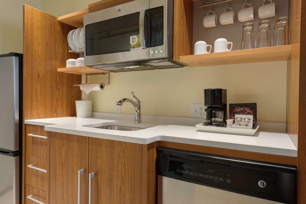 full-sized fridge, microwave, dishwasher, coffee/tea maker