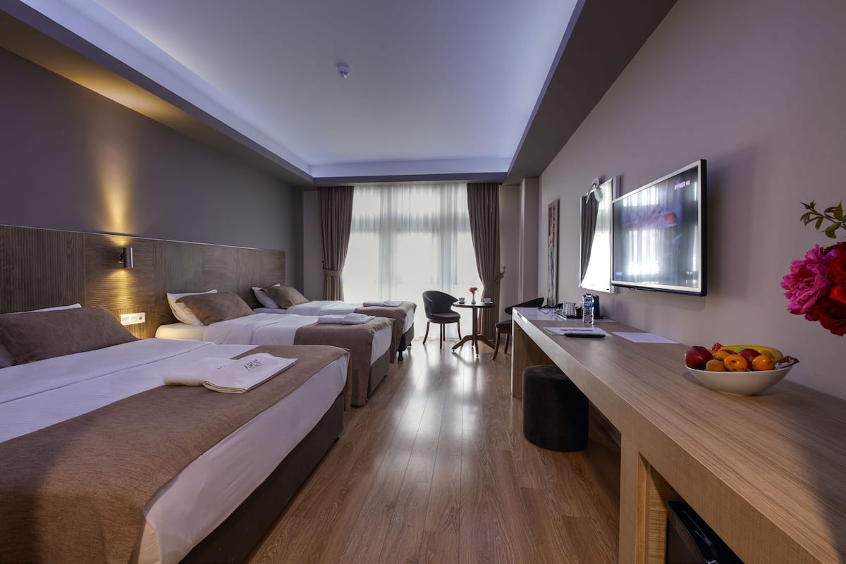 family quadruple room, multiple beds | premium bedding, select comfort beds, minibar, in-room safe