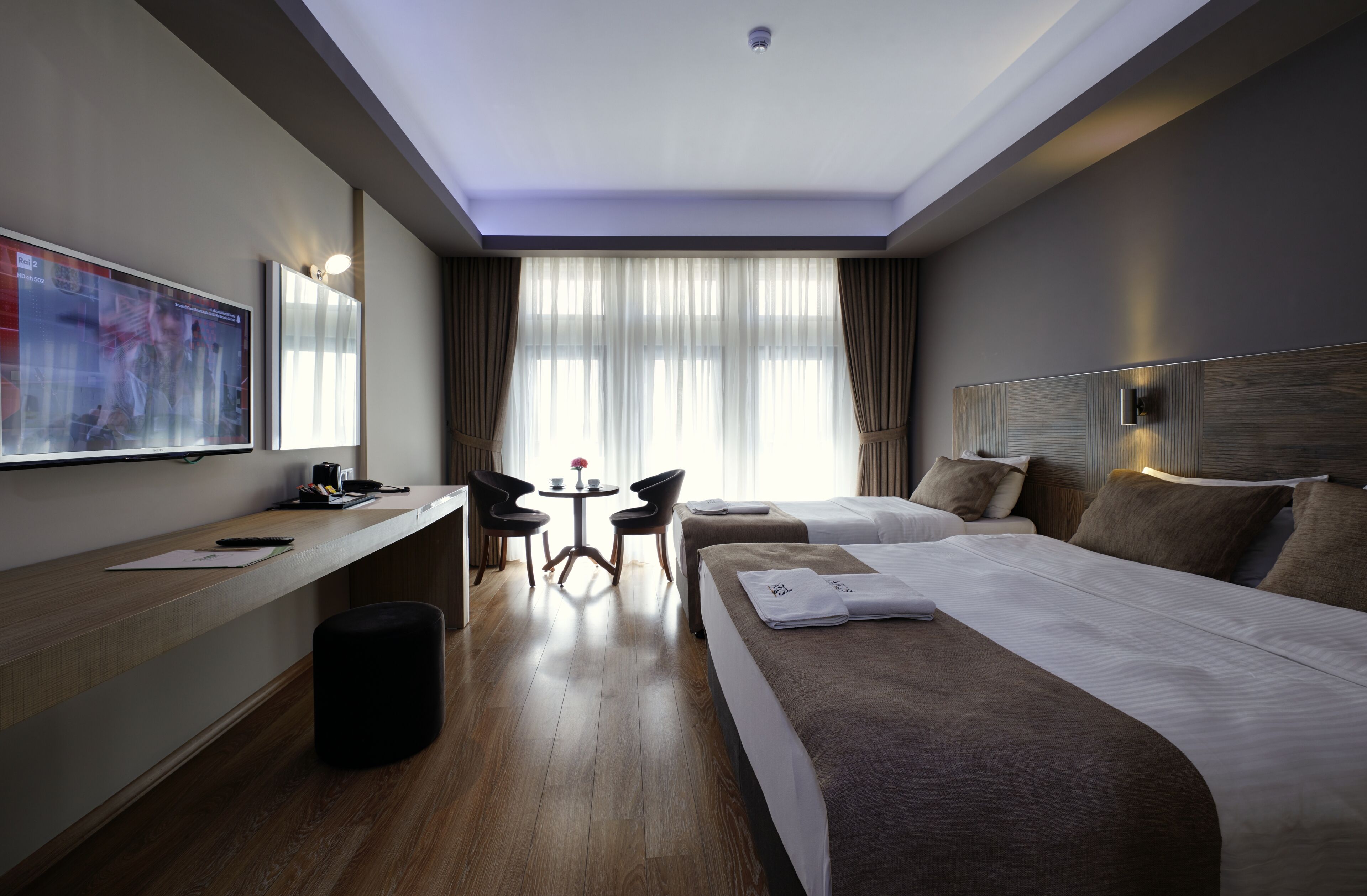 family triple room, multiple beds | premium bedding, select comfort beds, minibar, in-room safe