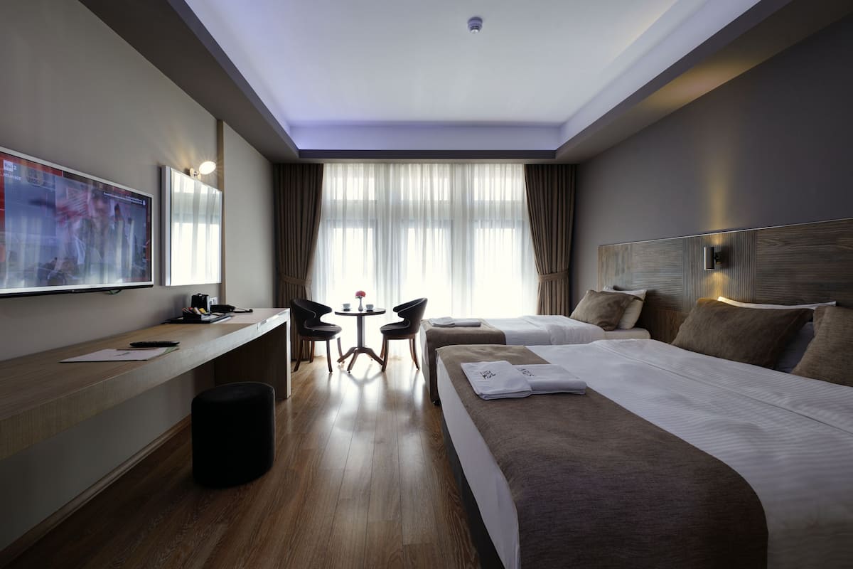 family triple room, multiple beds | premium bedding, select comfort beds, minibar, in-room safe