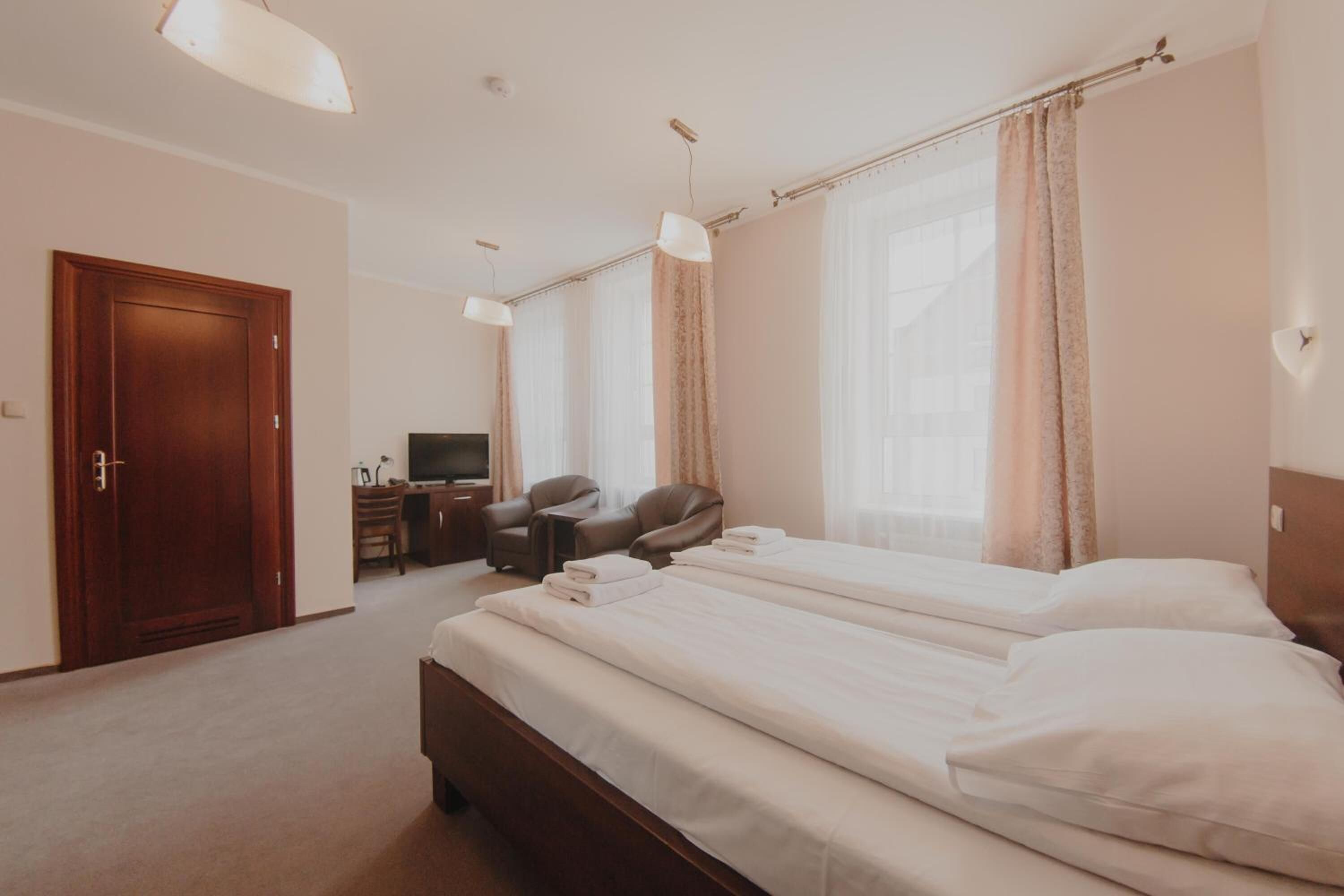 premium bedding, desk, iron/ironing board, bed sheets