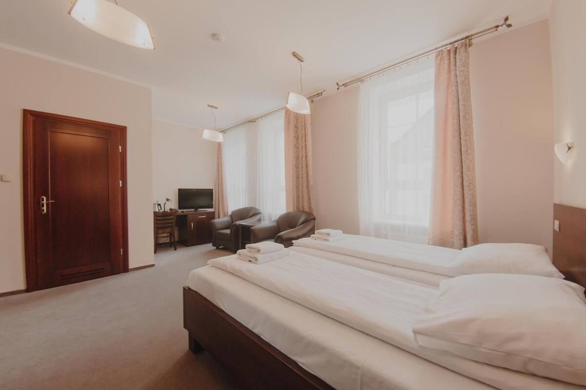 premium bedding, desk, iron/ironing board, bed sheets