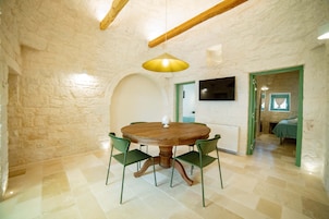 Deluxe Condo | Living area | Flat-screen TV