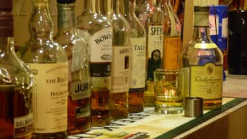 A variety of liquor bottles on a counter.