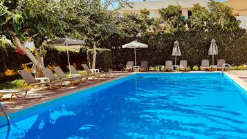 Seasonal outdoor pool, pool umbrellas, sun loungers
