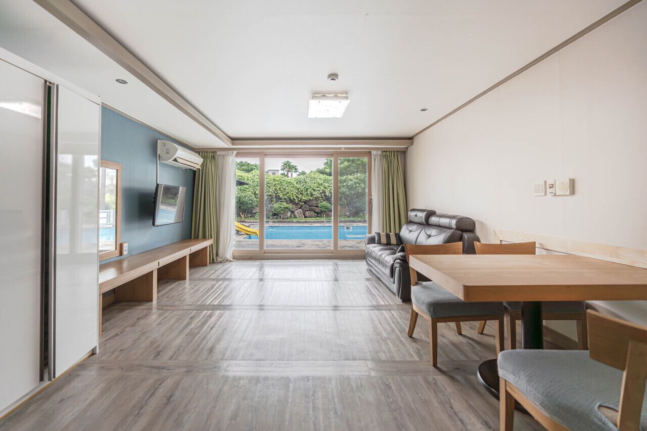 Poolside Suite, 35PY, Duplex | Living area | Flat-screen TV