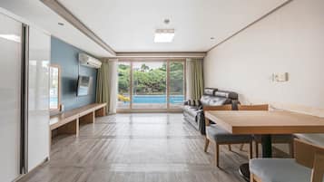 Poolside Suite, 35PY, Duplex | Living area | Flat-screen TV