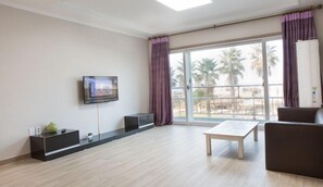 Room, 2 Bedrooms | Living area | 50-inch flat-screen TV with cable channels, TV, heated floors - Moonkle (Jeju City)