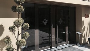 A building entrance with the sign "THE BLACK" above the doors. - The Black Hotel (Eskisehir)