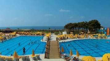 Indoor pool, outdoor pool, pool umbrellas, pool loungers