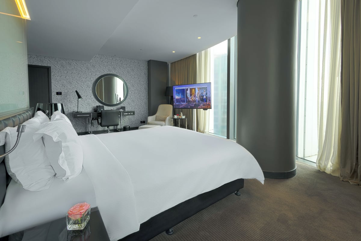 Room, 1 King Bed, City View (Guest) | Down comforters, in-room safe, desk, laptop workspace