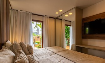 Bangalô | Minibar, in-room safe, blackout drapes, soundproofing