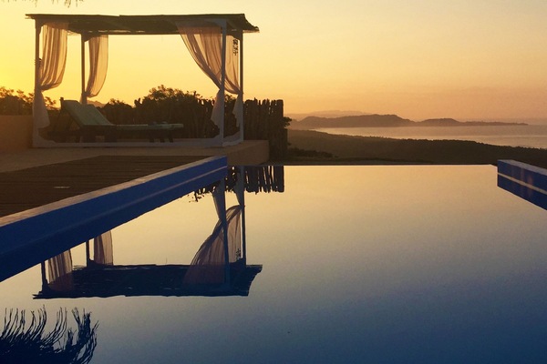 Outdoor pool, an infinity pool, open 6:00 AM to 9:00 PM, pool umbrellas