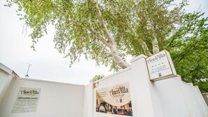 A guest house named AnnVilla with a disclaimer notice and contact information on the wall. - AnnVilla Guesthouse (Klerksdorp)