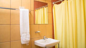 Ducha, artículos de higiene personal gratuitos, toallas y jabón