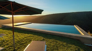 A swimming pool with a view of a forested hillside. - Alkantmooi Nature Reserve Keurkloof Units (Plettenberg Bay)