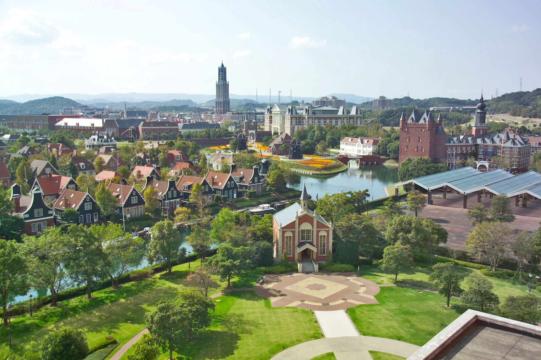 A historic town with traditional architecture, a central square, and a river.