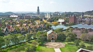 A historic town with traditional architecture, a central square, and a river.