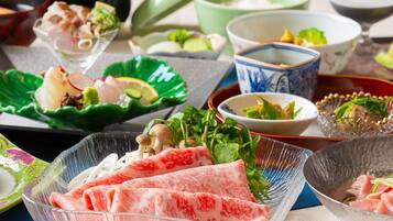 A variety of dishes on a table, including a bowl of sliced meat, a bowl of vegetables, and several other dishes in different bowls.
