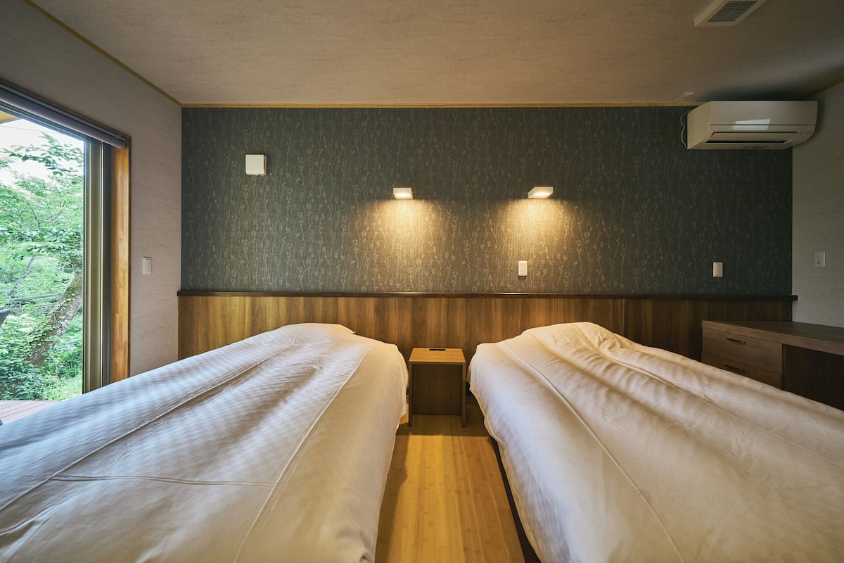 executive sakura japanese-western quad room | premium bedding, down duvets, in-room safe, iron/ironing board