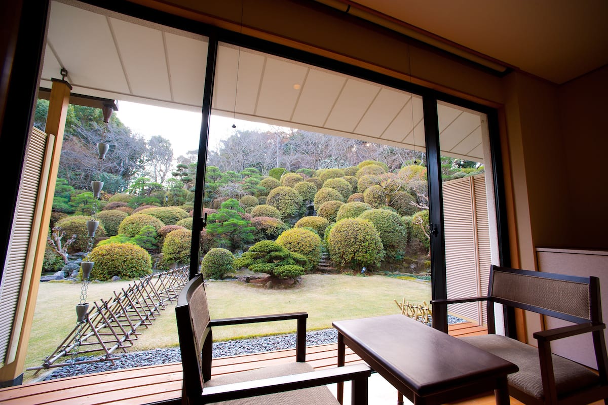 main building japanese traditional room, garden view | premium bedding, down duvets, in-room safe, iron/ironing board