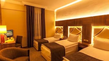 Standard Triple Room | Minibar, in-room safe, desk, soundproofing