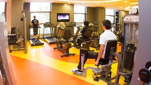 A gym with treadmills, stationary bikes, and weight machines.