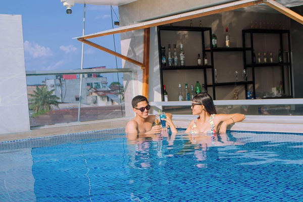 Outdoor pool, open 11:00 AM to 7:00 PM, pool umbrellas, pool loungers
