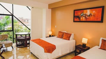 Twin Room | Minibar, in-room safe, desk, laptop workspace