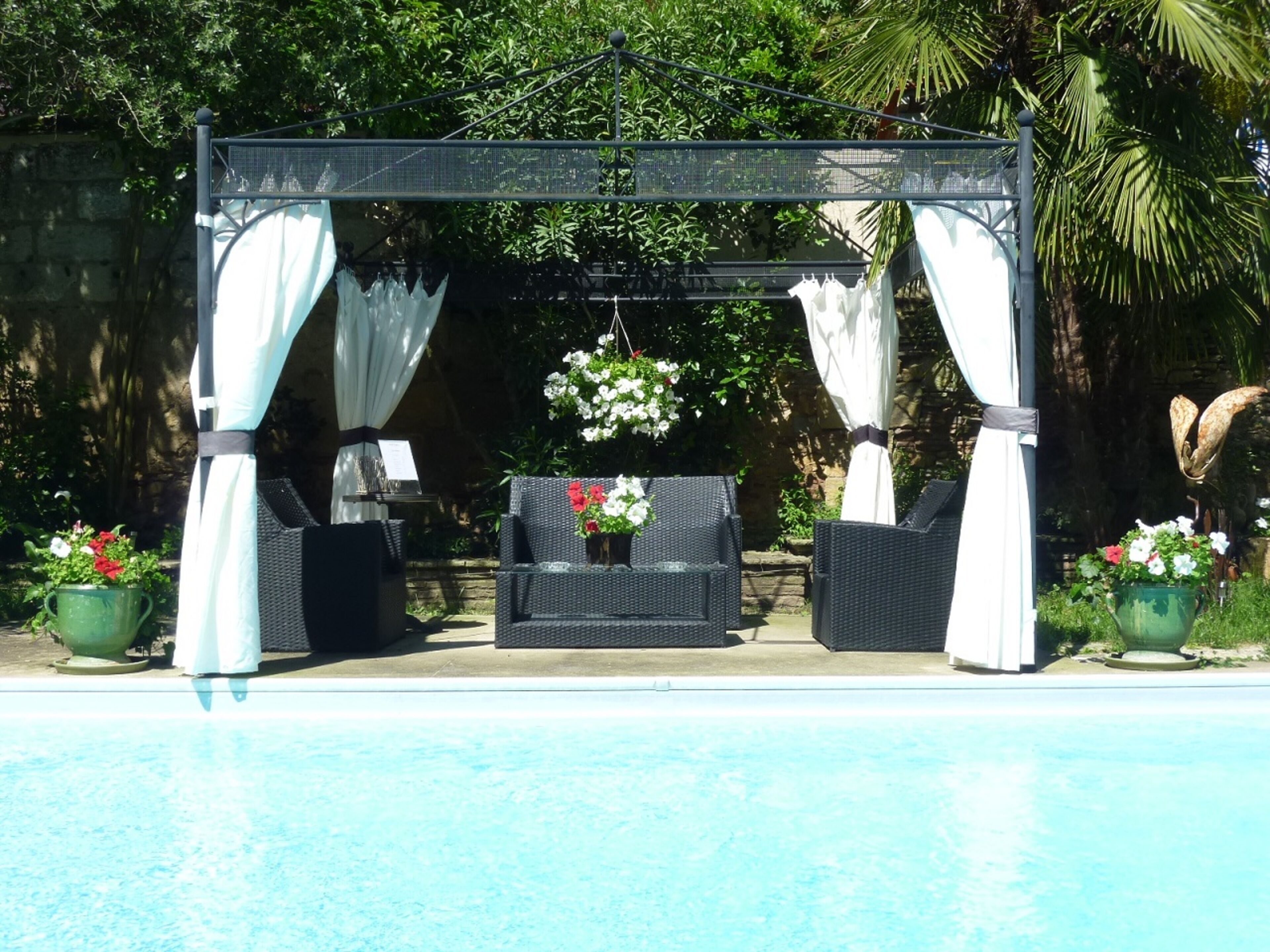 seasonal outdoor pool, open 10:00 am to 8:30 pm, pool umbrellas